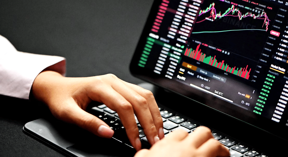 A trader analyzing financial data and charts